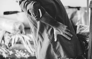 a person holding his back